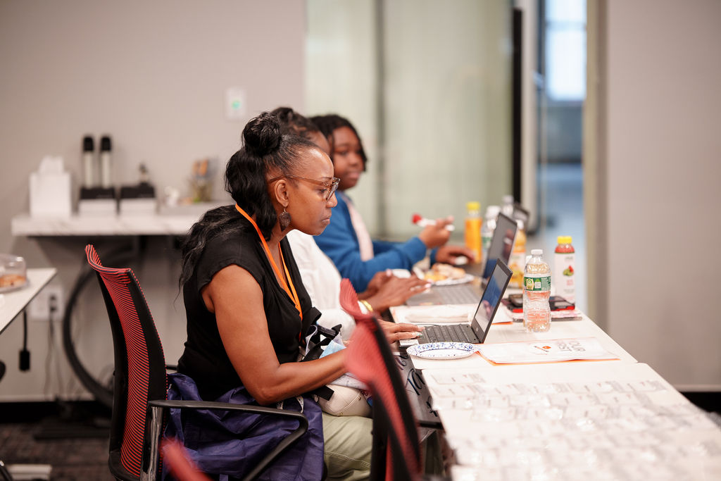 Attendee working on a laptop