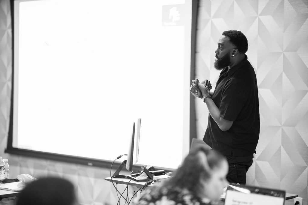 Coach teaching attendees during the live event